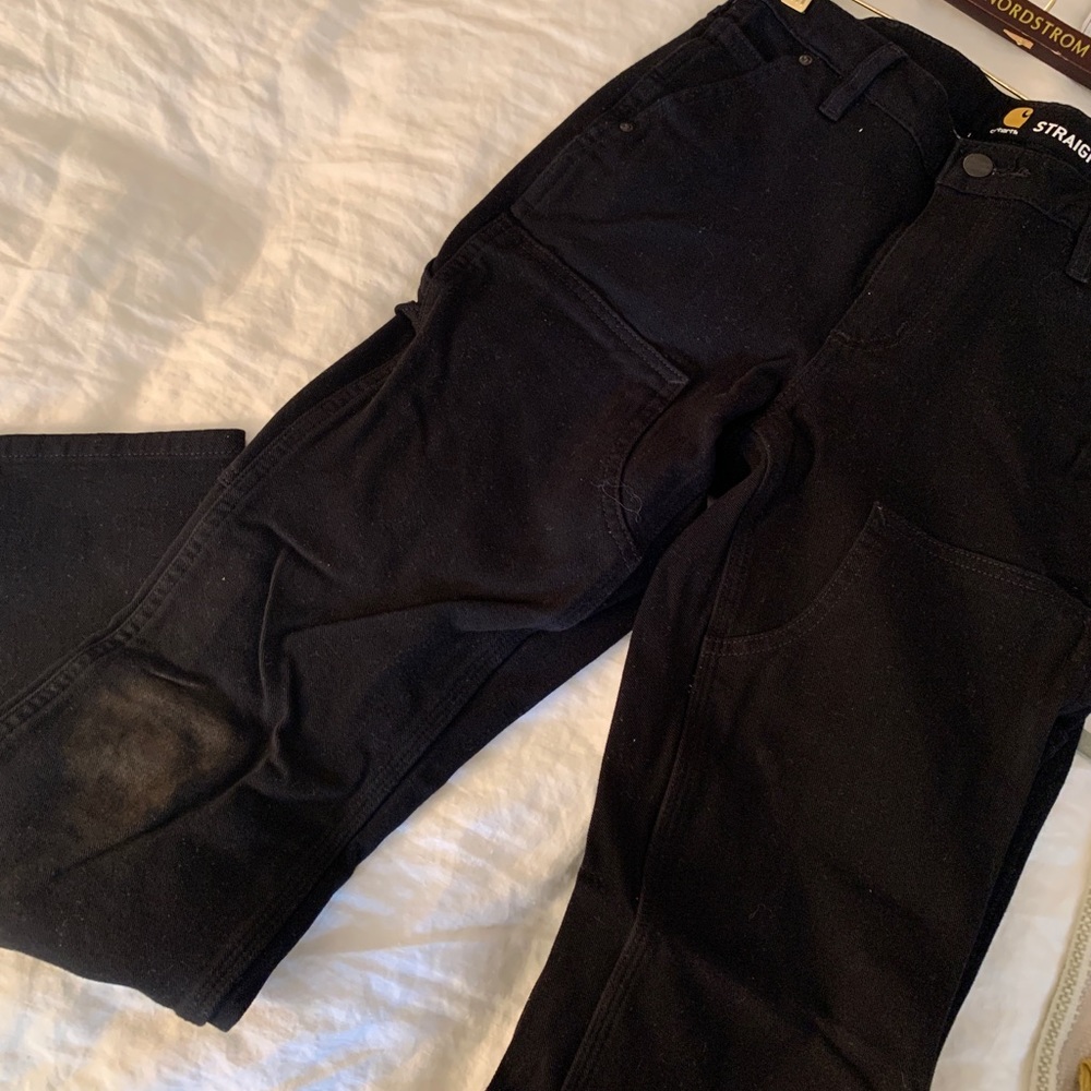 Carhartt women’s straight leg utility jeans with dirt-smudged knees